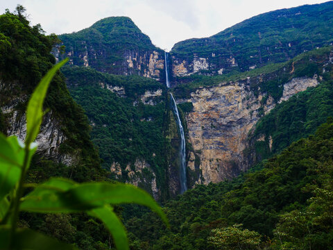 Majestic Gocta Waterfall cascading down lush green mountain cliffs in the Chachapoyas region of Peru