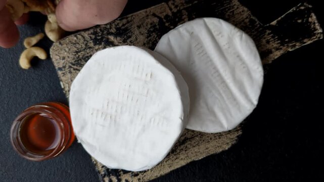 Brie or Camembert cheese is a white, round shape for baking and melting. Camembert cheese as a food background for your design