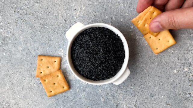 Black caviar from beluga or sturgeon, an expensive delicacy for sandwiches. Black caviar as a food background for your design