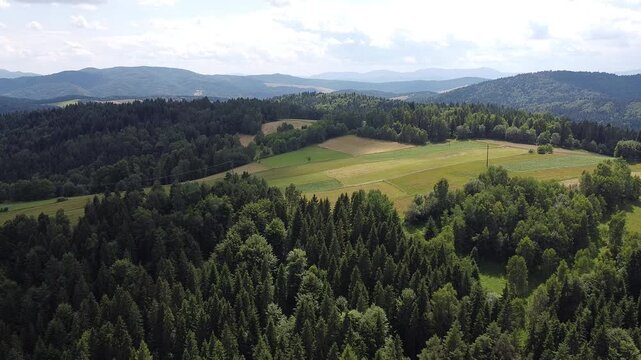 Aerial view of EuroVelo 11 bike path along Poprad river in summer, drone shot of scenic cycling route between Krynica-Zdroj, Muszyna and Rytro in Beskid Sadecki mountains, Poland.