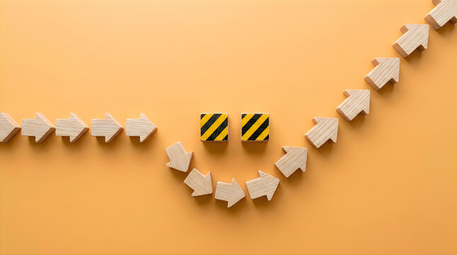 Wooden arrows following in a circle with two warning blocks in the middle
