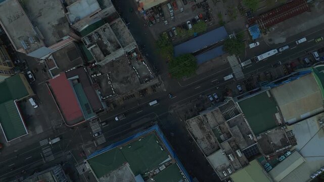 Top-down aerial view of busy intersection in Tabaco City Albay, Philippines. Ideal for themes of transportation and urban concepts.