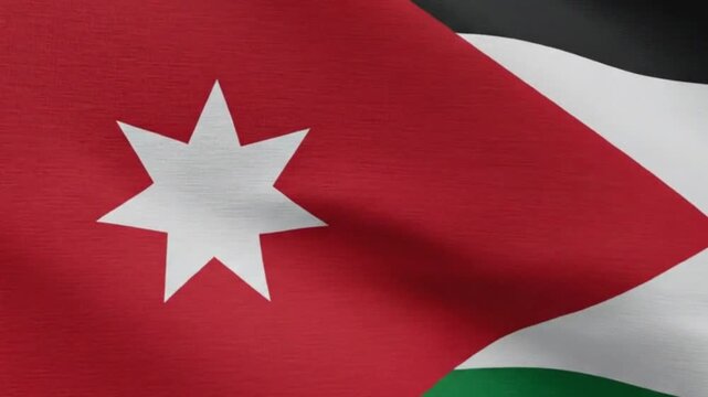 Flag of jordan waving on a flagpole against a plain background