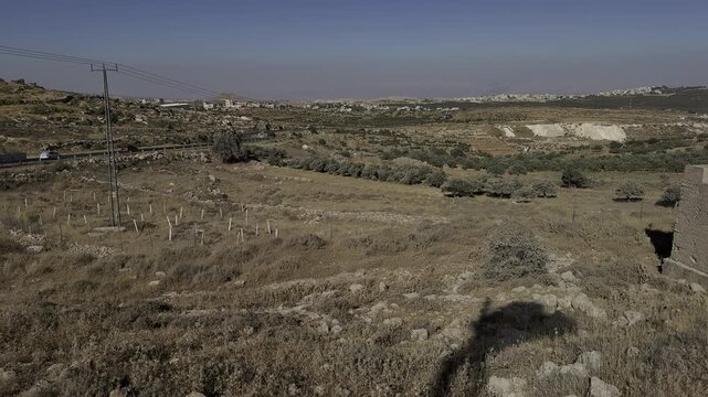 Road connecting different parts of Gush Etzion, in an area where new settlement expansion is planned. The view includes remnants of former Jordanian checkpoints and fortifications, with the Judean Des