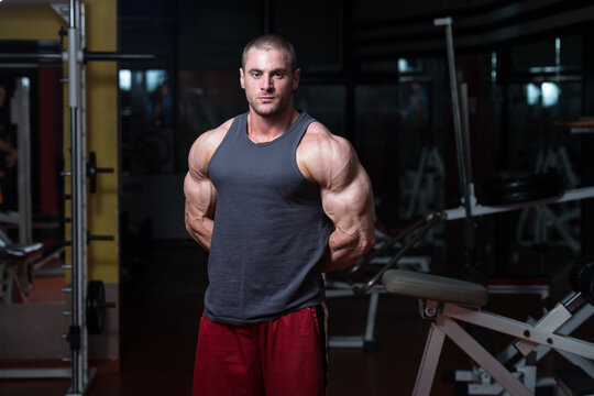 Young Bodybuilder Flexing Muscles