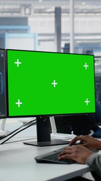 Vertical Video Chroma key PC, reviewing microchip production and R&D factory specialist using AI model, using machine learning, isolated screen computer and SOC architect upgrading semiconductor
