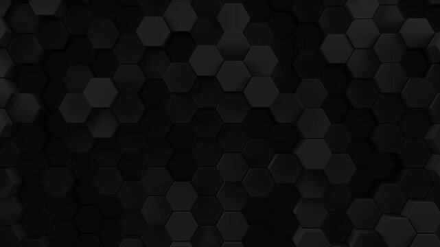 Black background of patterned hexagons. Smooth movement of 3d rendered hex shapes creating a visual of a sleek dark shadowy motion for futuristic scientific or technical backgrounds. 3d render loop.