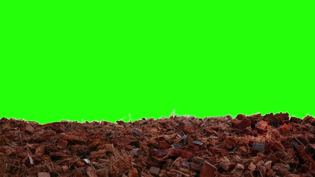 Abstract coconut husk chips on fibre pellets for rapid plant growth with sunlight light motion  isolated against green background