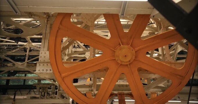 Large Orange Spoked Wheel, Industrial Machinery of Gondola In Hiroshima Japan