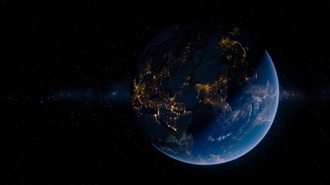 View of Earth at night showing illuminated cities and continents from space with stars in the background