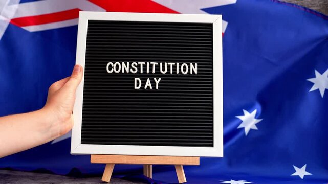 Patriotic Australian flag and signage Australia constitution day. Concept of civil rights and law legal awareness or civic holiday media. Celebration card