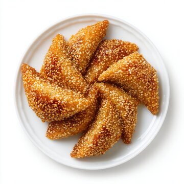 Moroccan chebakia pastries coated with sesame seeds and honey isolated on a white background