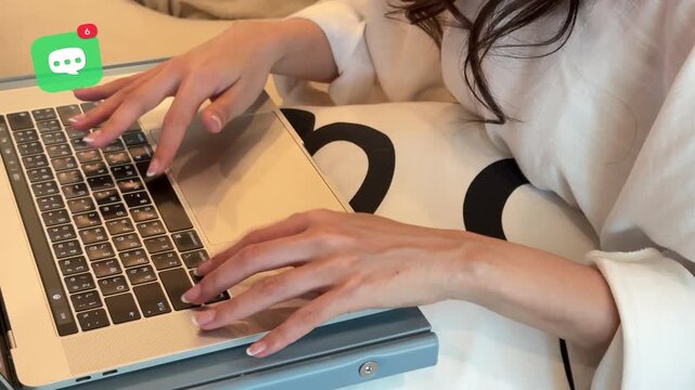Top view of a young East Asian woman typing on her laptop at home, featuring a 3D tracked digital speech bubble icon with counter numbers for online communication.