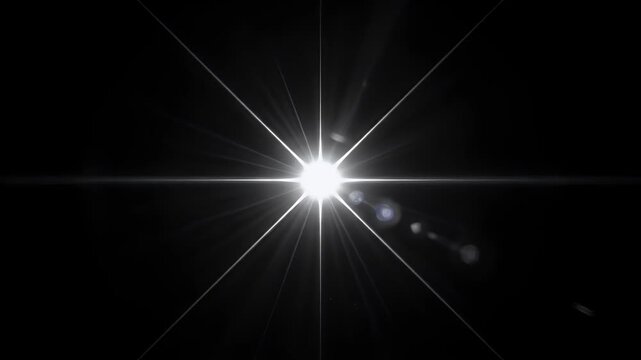 Lens flare light effect with bright starburst rays isolated on a black background for video edit