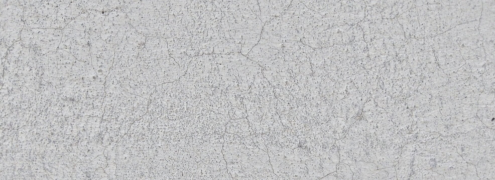 Weathered concrete texture with fine cracks, light gray cement wall background, industrial stone surface for architectural design and 3D rendering