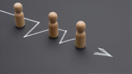 Obraz premium Wooden figures follow a rising arrow, symbolizing growth and progress.