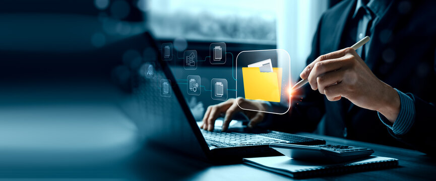 Digital document management concept with business professional using laptop and stylus showing virtual folder interface connected files cloud storage workflow and office data organization