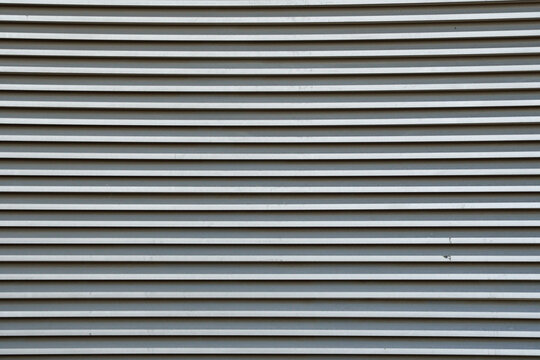 Close-up view of metal elevator with parallel lines