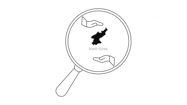 Magnifying glass over North Korea map with hands reaching out.