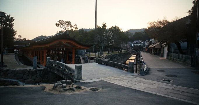 Traditional Japanese Shrine Gate Tunnel and Street at Dusk In Miyajima