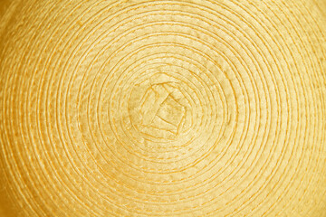 Fototapeta premium Gold yellow fabric with spiral patterns abstract on background