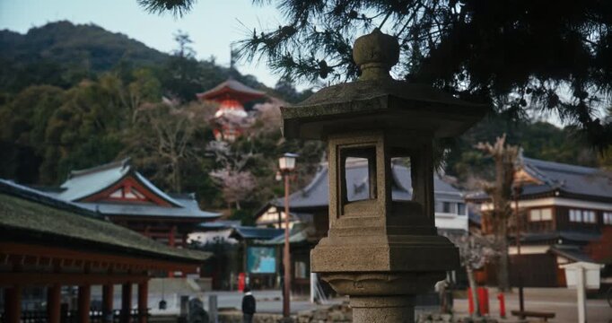 Ancient Stone Lantern at Japanese Shrine Complex In Hiroshima, Japan - Slow Motion