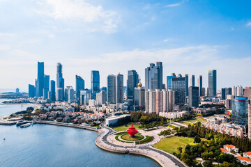 Fototapeta premium Aerial view of coastline of Fushan Bay and skycrapers in Qingdao, Shandong Province, China
