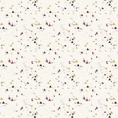 Fototapeta premium Confetti elements featuring small shapes and abstract marks scattered across a clean surface represent a celebratory mood.