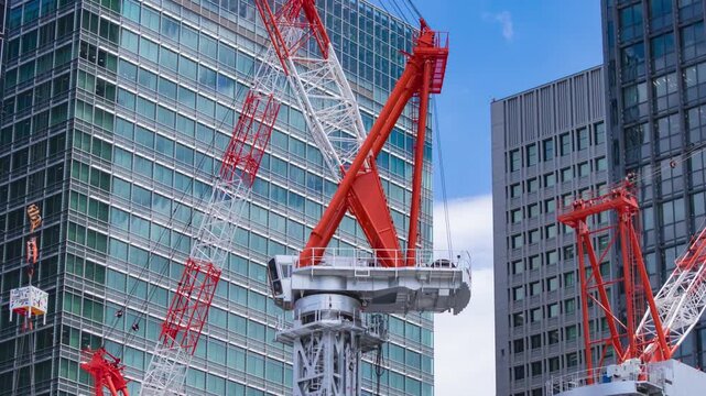 A timelapse of moving crane at the underconsumption in the business town zoom