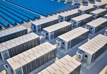 Group of energy storage systems or battery container units with solar panels © phonlamaiphoto