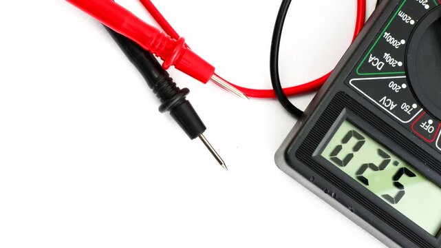 Close-up of a multimeter on a clear surface, highlighting precision and versatility for electrical measurements.