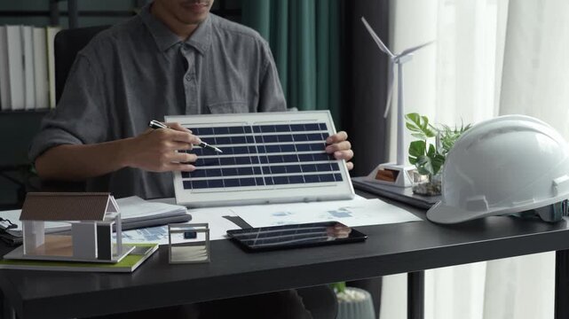 Electrical engineer working with solar panel sustainable energy concept