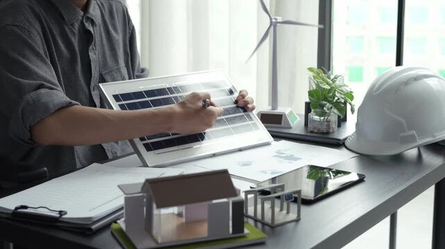 Electrical engineer working with solar panel sustainable energy concept