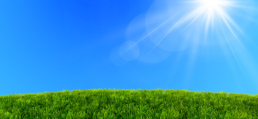 Bright sunbeams over green grass field under clear blue sky perfect for peaceful natural landscapes and outdoor environments