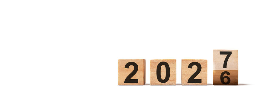 Wooden blocks transitioning to 2027 on white background perfect for exciting new year countdowns and successful future events