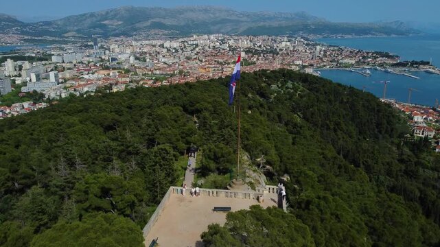 Croatian flag waving on marjan hill peak overlooking split