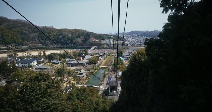 Aerial Gondola Wires, View Over Japanese Town and River Valley Hiroshima