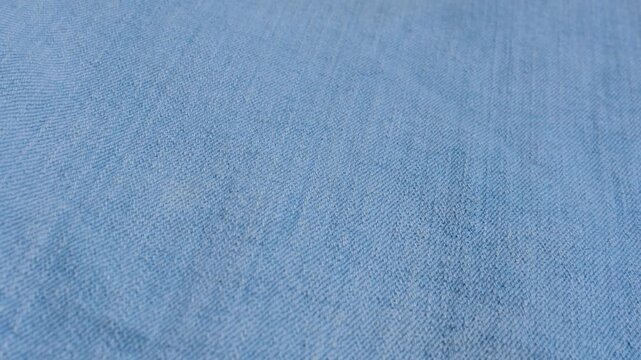 Detailed denim close-up, revealing the indigo blue texture and stitching, perfect for fashion and design projects.