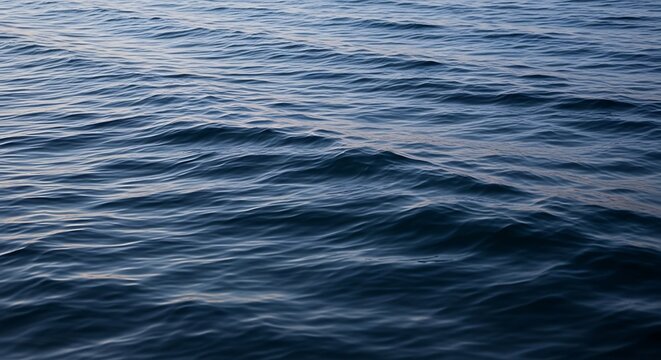 Deep blue ocean water surface waves texture.