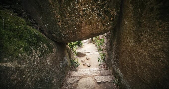Narrow Rock Passage Hiking Trail Through Boulders In Miyajima, Japan - Steady Cam