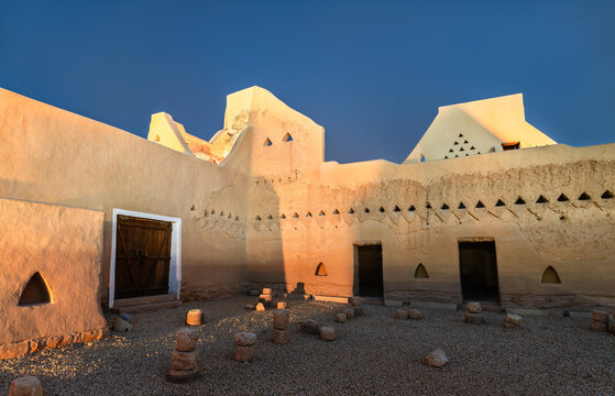 Classic Najdi style mud architecture at the historic At-Turaif World Heritage Site in Diriyah, Saudi Arabia during sunset.