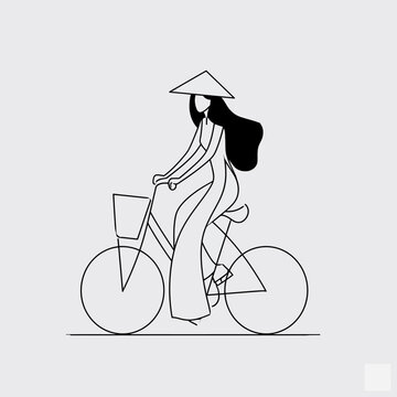Vietnamese woman in ao dai riding a bicycle on street
