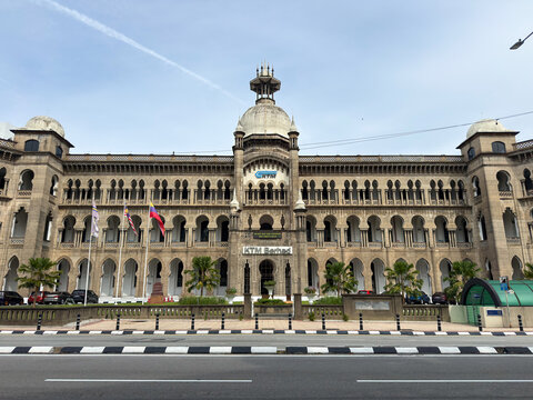 Kuala Lumpur, Malaysia - April 15, 2026: KTM Berhad Headquarters Full Facade with Flags and Palm Trees