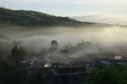 A Quiet Village Shrouded in Mist at the Foot of Mount Ijen, Indonesia