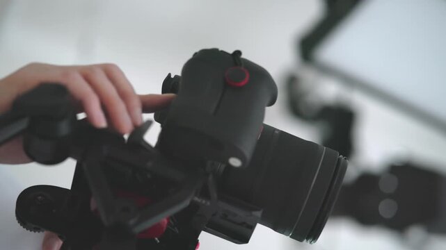 Close up of Videographer Finger Pressing Button on Mirrorless Camera Body