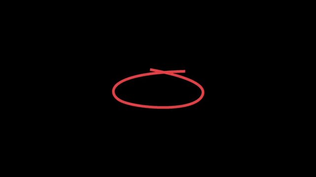 A red rubber band with a twist on a black background