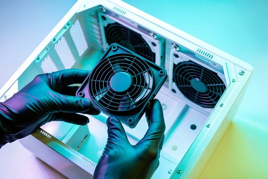 hand install cooling fan inside open computer case. PC hardware upgrade