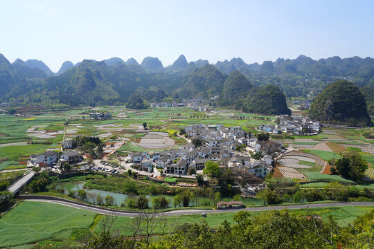 A small rural village amidst the stunning scenery of Wanfenglin (Forest of Ten Thousand Peaks) national park in Xingyi, Guizhou, China