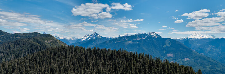 Naklejka premium Panoramic Mountain Landscape Over Fraser Valley Forest With Snowcapped Peaks Near Chilliwack BC, Canada