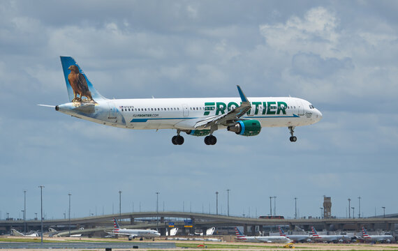 Frontier Airlines aircraft Airbus A321 landing at the Dallas Fort Worth International Airport (DFW). Gordon the Golden Eagle livery. 